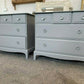 Pair Of Grey Painted Stag Minstrel Drawers