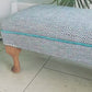 Long, Low Footstool, Restored and Reupholstered in Top Quality Woven Fabric.Teak wood feet. Newly Reupholstered.