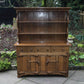 A RUPERT / NIGEL GRIFFITHS MONASTIC CARVED OAK DERBYSHIRE DRESSER / SIDEBOARD.