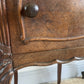 A near pair of antique French walnut and marble bedside tables