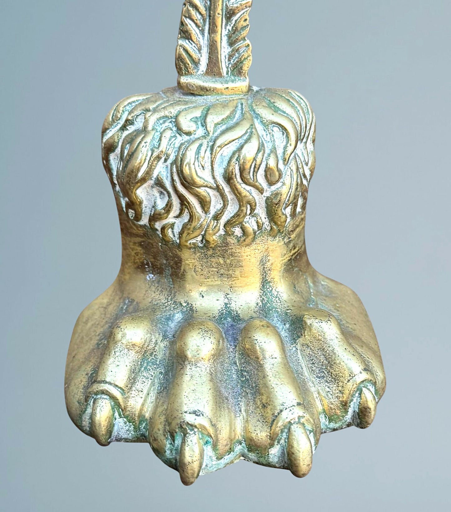 A Near Pair of 19th Century Brass Lion Paw Door Porters