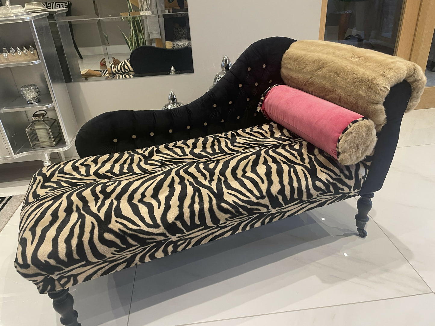 Baby chaise lounge in velvet zebra print and faux mink fur roll top