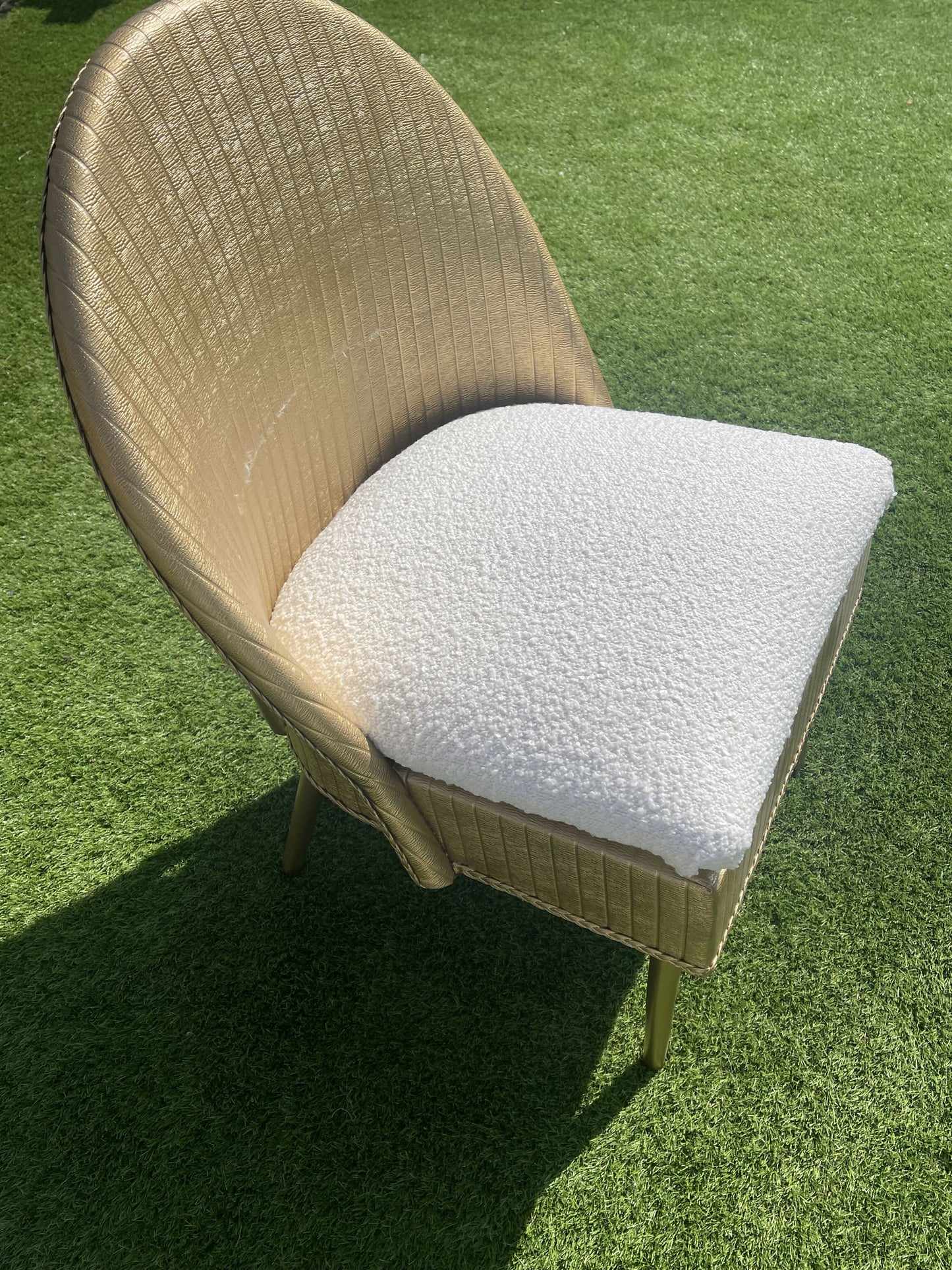 Gold wipe clean accent chair with luxurious white boucle fabric and some sneaky storage