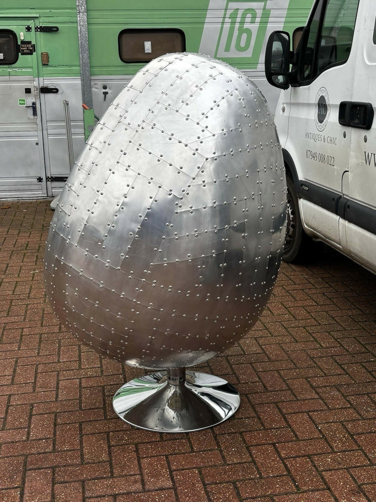 Aviation Swivel Egg Chair With Tan Leather.