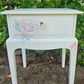 Stag Minstrel 'leggy' beside table with drawer painted in clotted cream