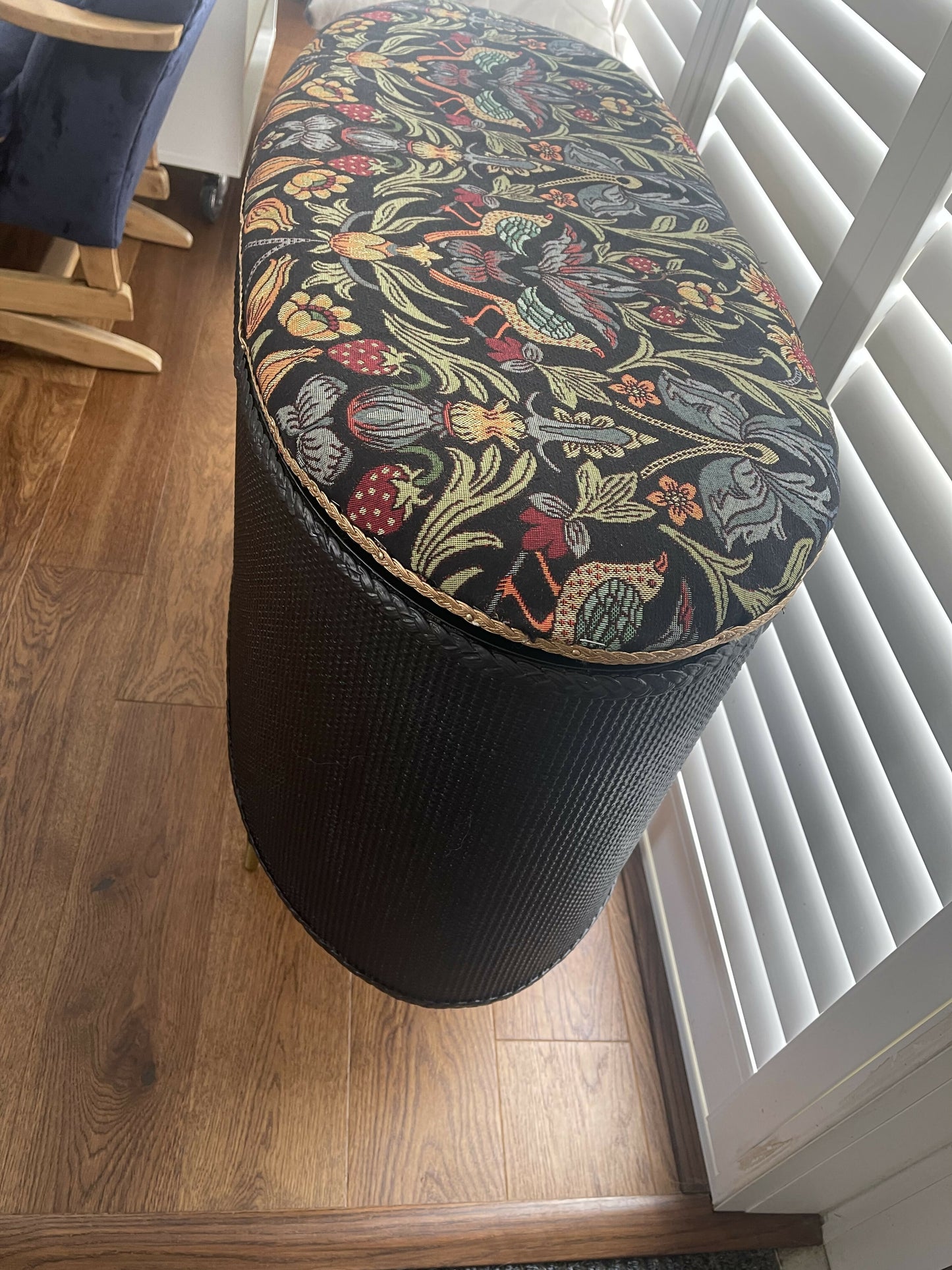 Black oval mid century modern ottoman - black paint William Morris style fabric
