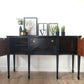 Black vintage serpentine sideboard