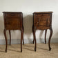A near pair of antique French walnut and marble bedside tables
