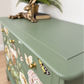 Sage green Stag Minstrel chest of drawers with neutral floral design. 3 over 2. Sideboard, dresser, bedside table