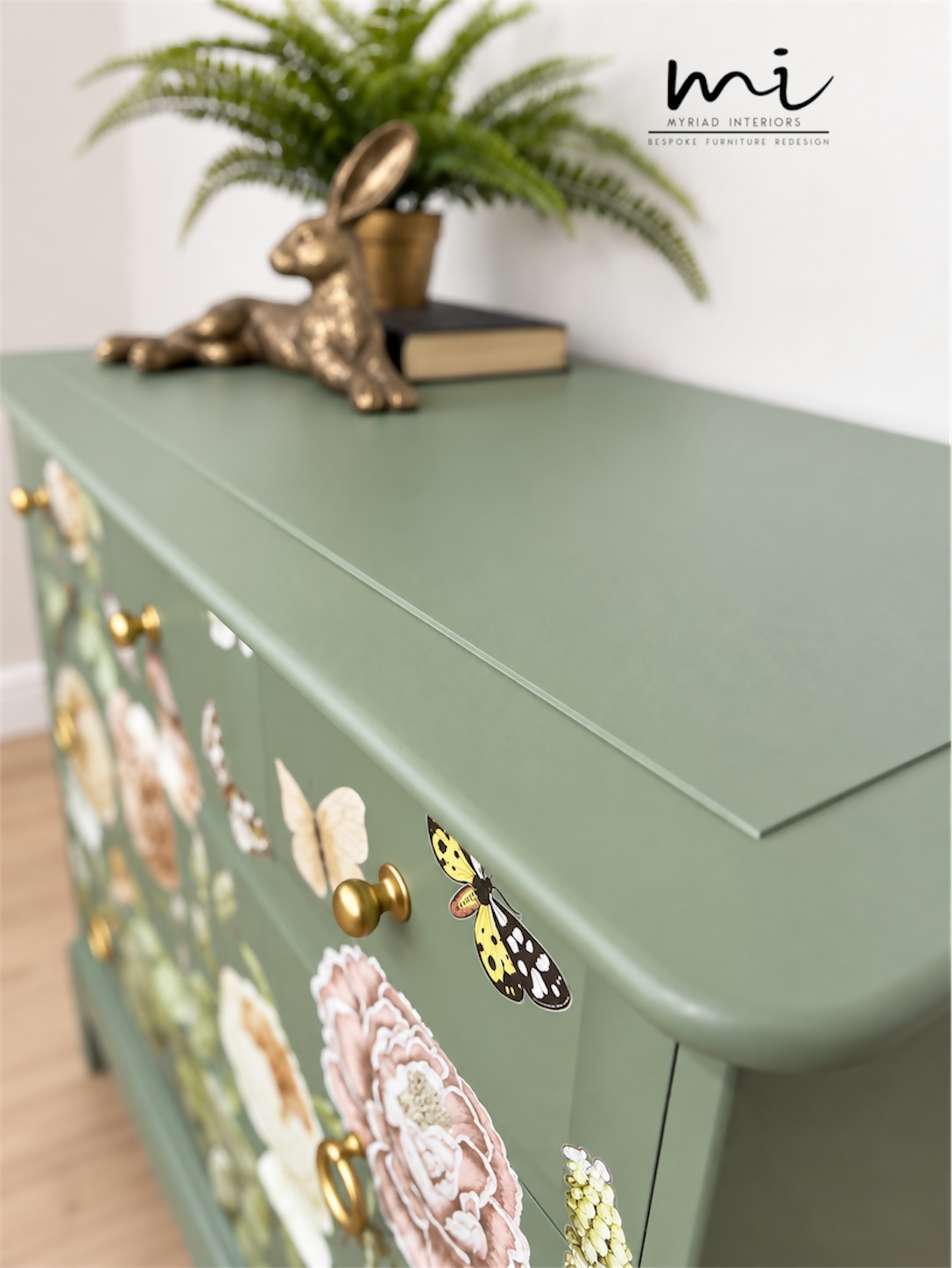 Sage green Stag Minstrel chest of drawers with neutral floral design. 3 over 2. Sideboard, dresser, bedside table