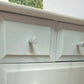 Stag Minstrel Chest of Drawers on Grey, Oversize bedside table