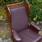 A NIGEL RUPERT GRIFFITHS MONASTIC CARVED OAK LEATHER FIRESIDE CHAIR / ARMCHAIR