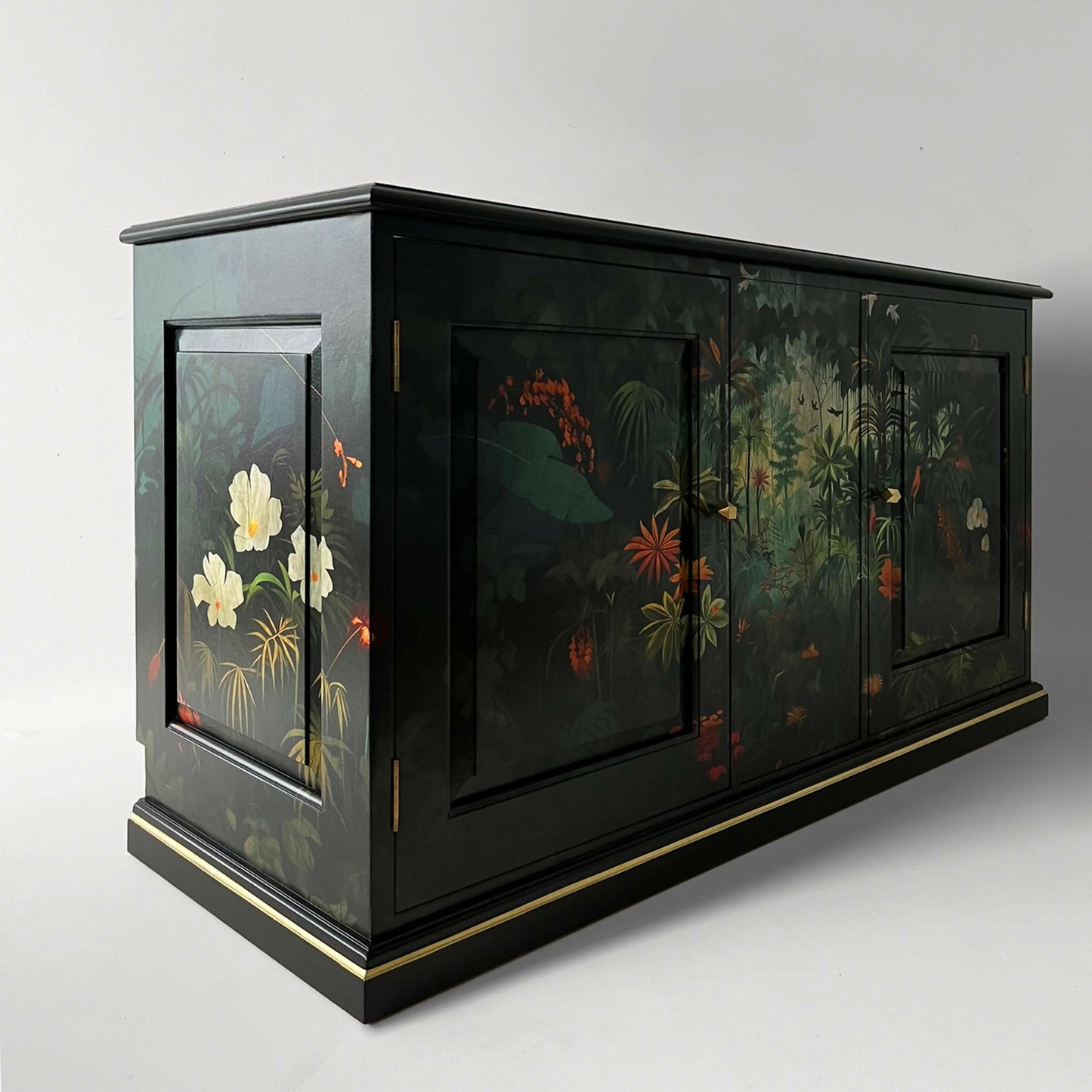 Vintage cabinet TV painted black and decorated with exotic rainforest jungle design in front and sides from angle