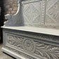 Edwardian antique Settle in solid oak with ornate carvings.