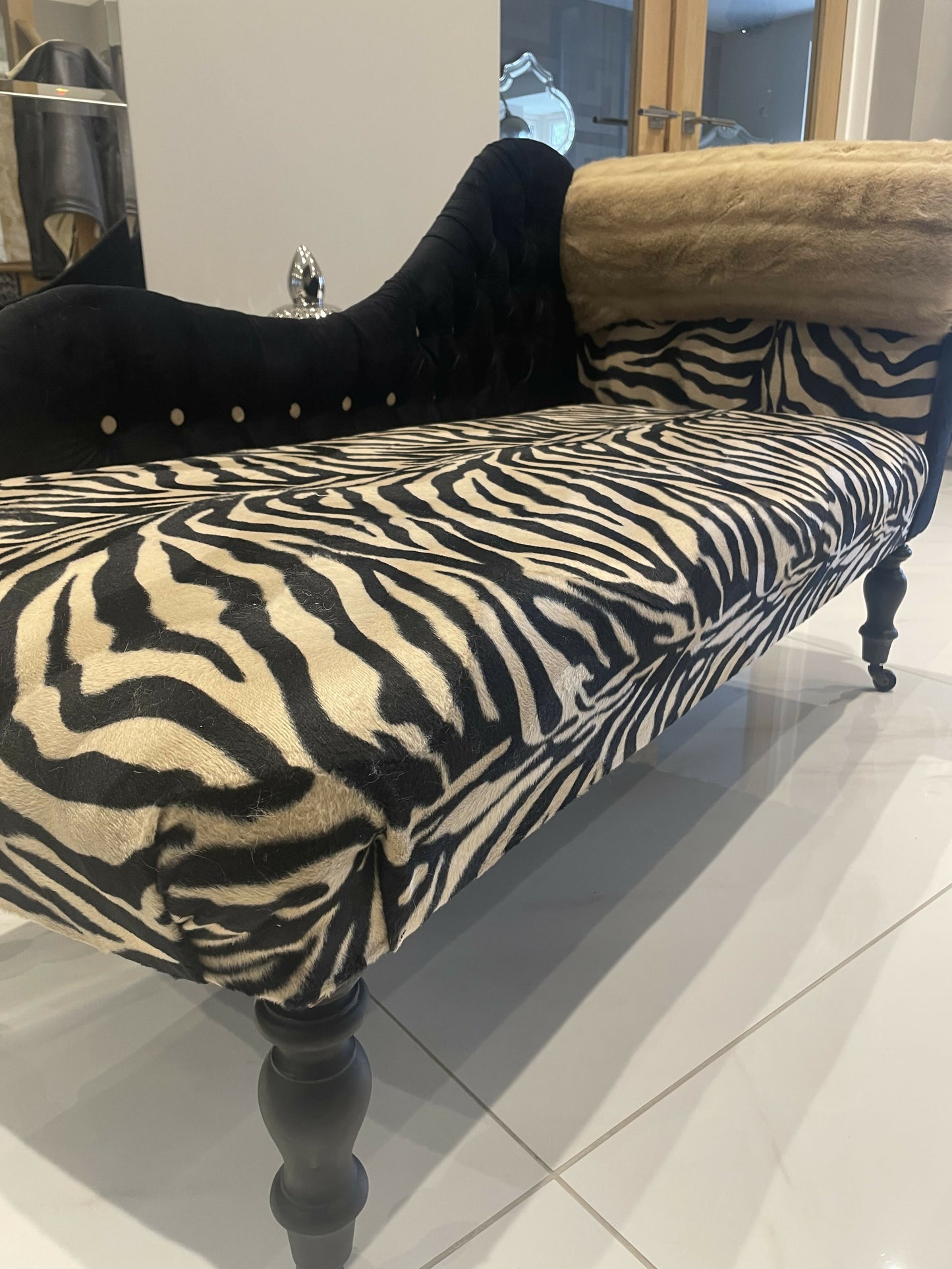 Baby chaise lounge in velvet zebra print and faux mink fur roll top