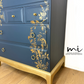 Refinished Stag Minstrel Tallboy Chest Of Drawers In Navy Blue With Gold Foil Floral Bird Design