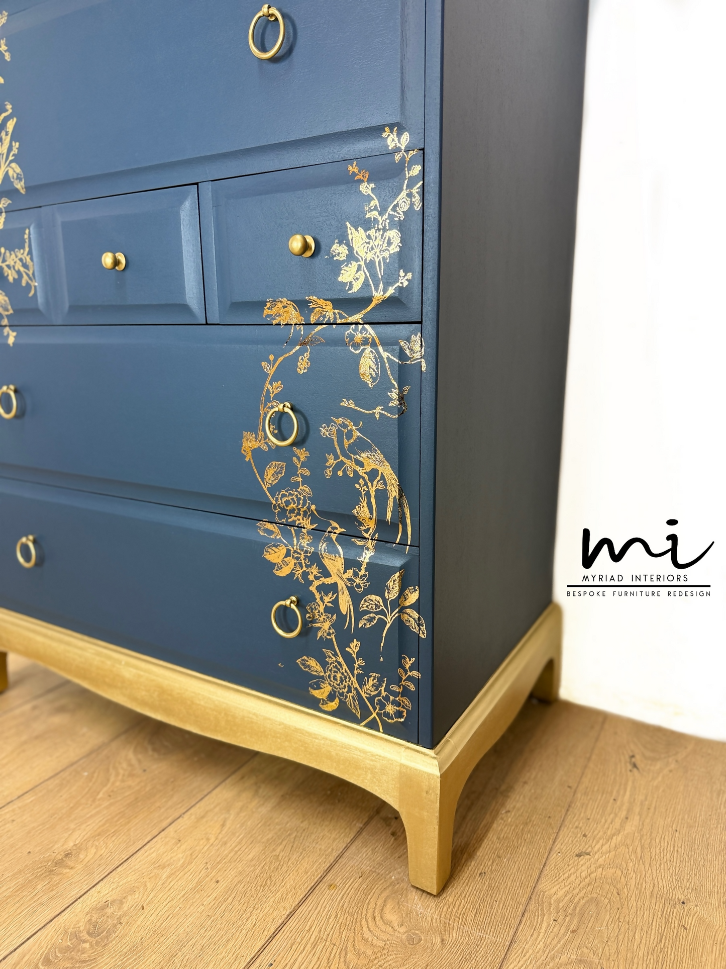 Refinished Stag Minstrel Tallboy Chest Of Drawers In Navy Blue With Gold Foil Floral Bird Design