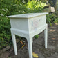 Stag Minstrel 'leggy' beside table with drawer painted in clotted cream