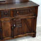 A NIGEL RUPERT GRIFFITHS MONASTIC CARVED OAK DRESSER BASE / SIDEBOARD / CABINET / CUPBOARD.
