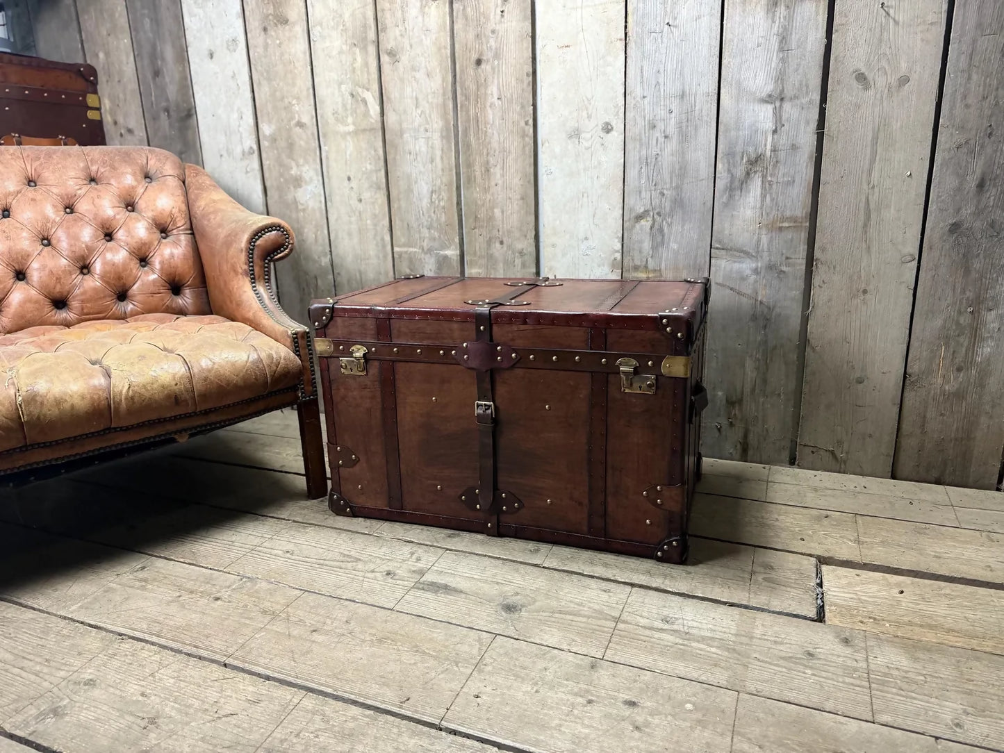 Antique leather trimmed chestnut brown campaign chest