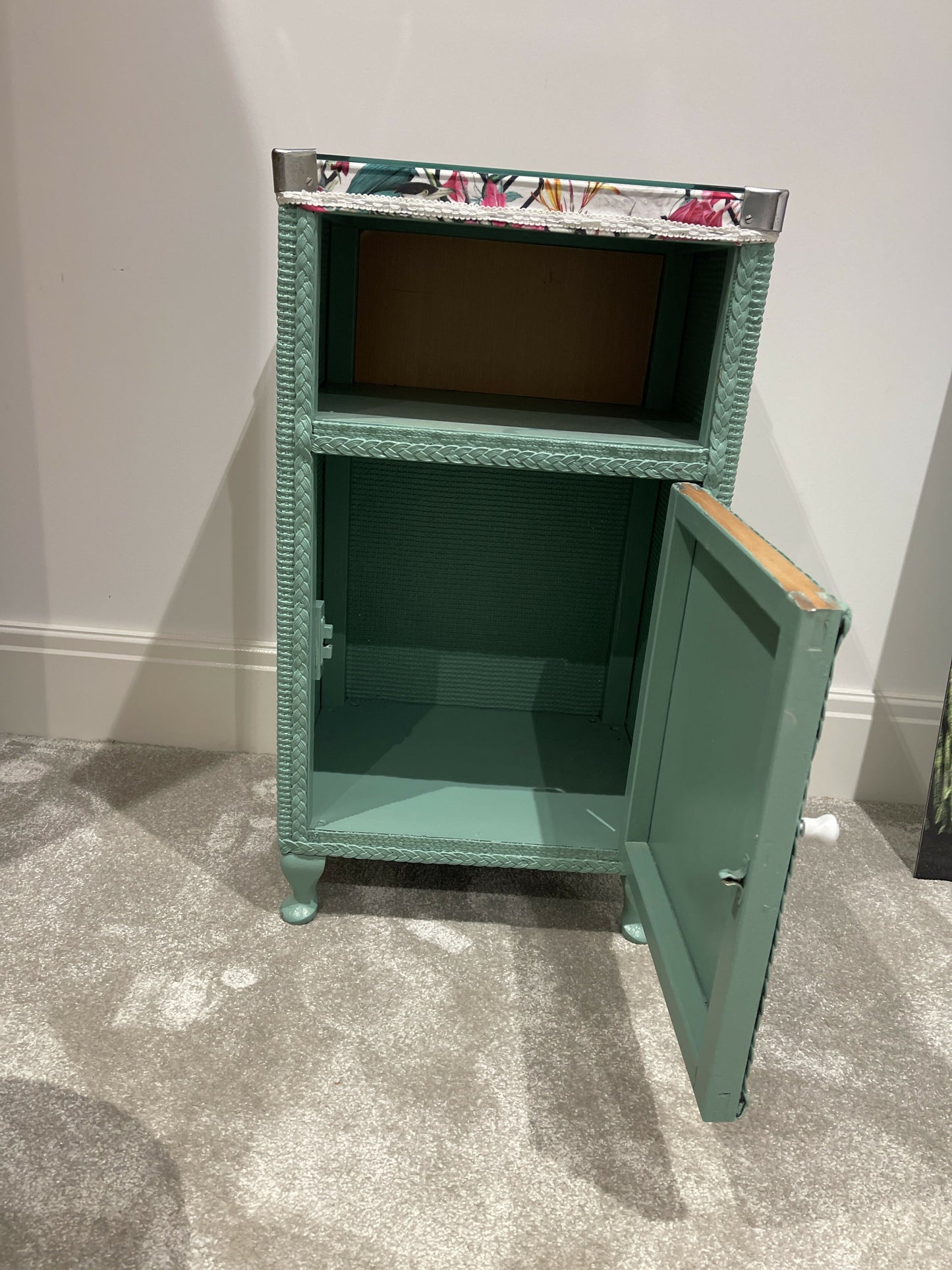 Green painted glass topped cabinet. Beautiful fabric accent top.