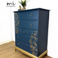 Refinished Stag Minstrel Tallboy Chest Of Drawers In Navy Blue With Gold Foil Floral Bird Design