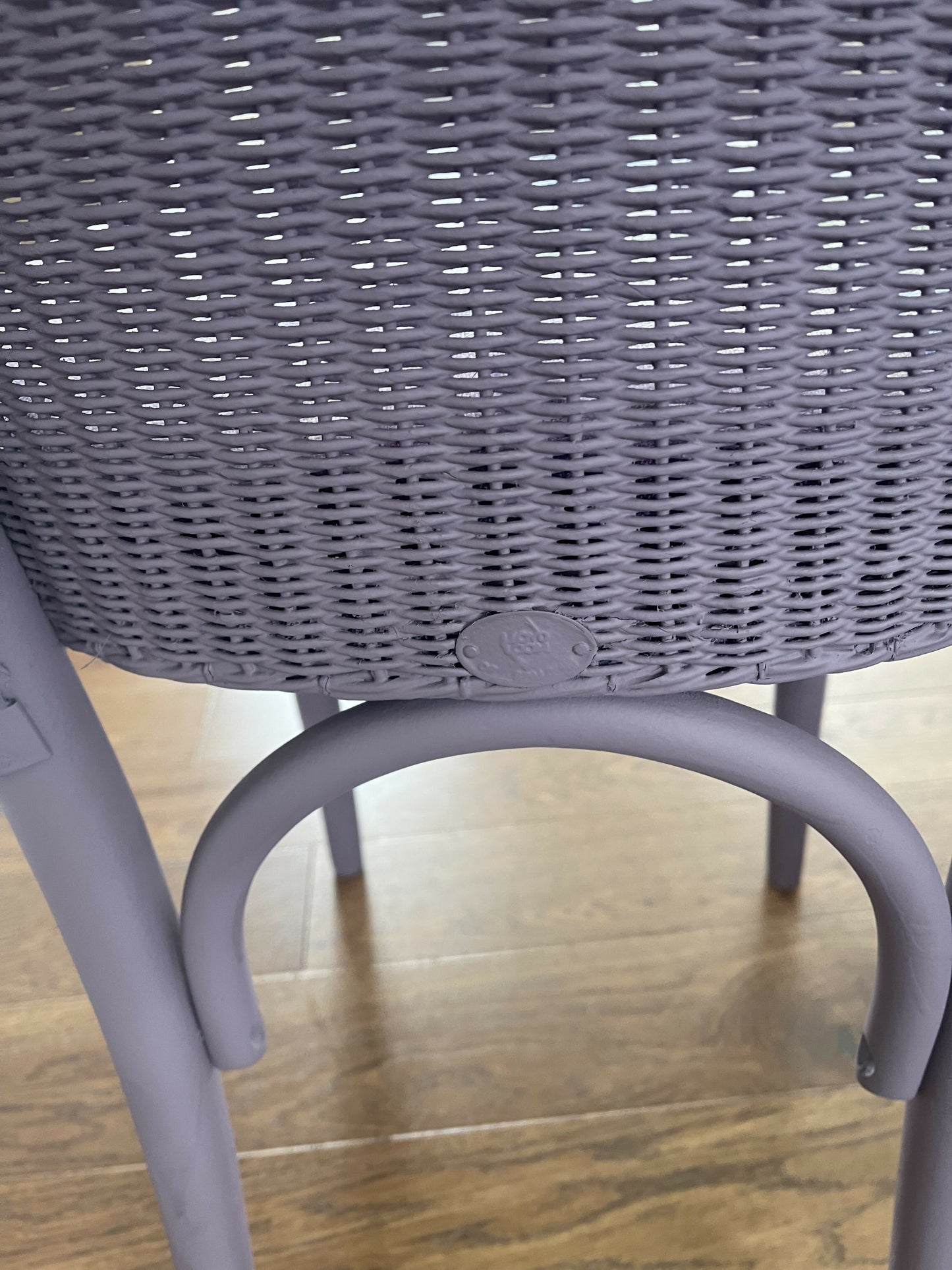 Stylish Lloyd loom accent chair very Matt aubergine paint and matching cotton lily themed fabric