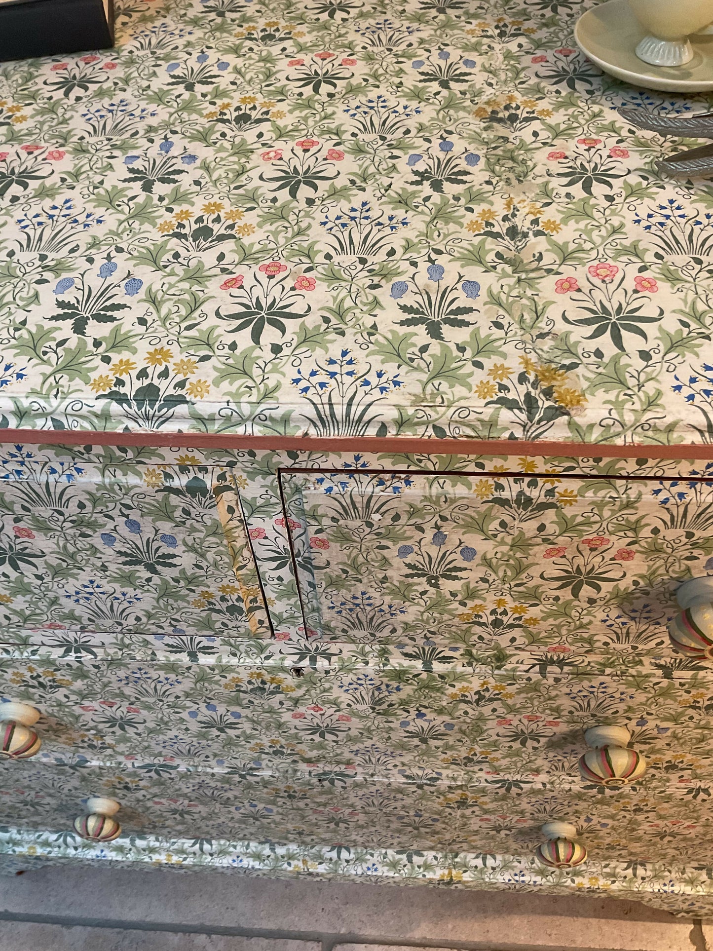 Antique chest of drawers covered in William Morris decoupage. With hand painted handles.
