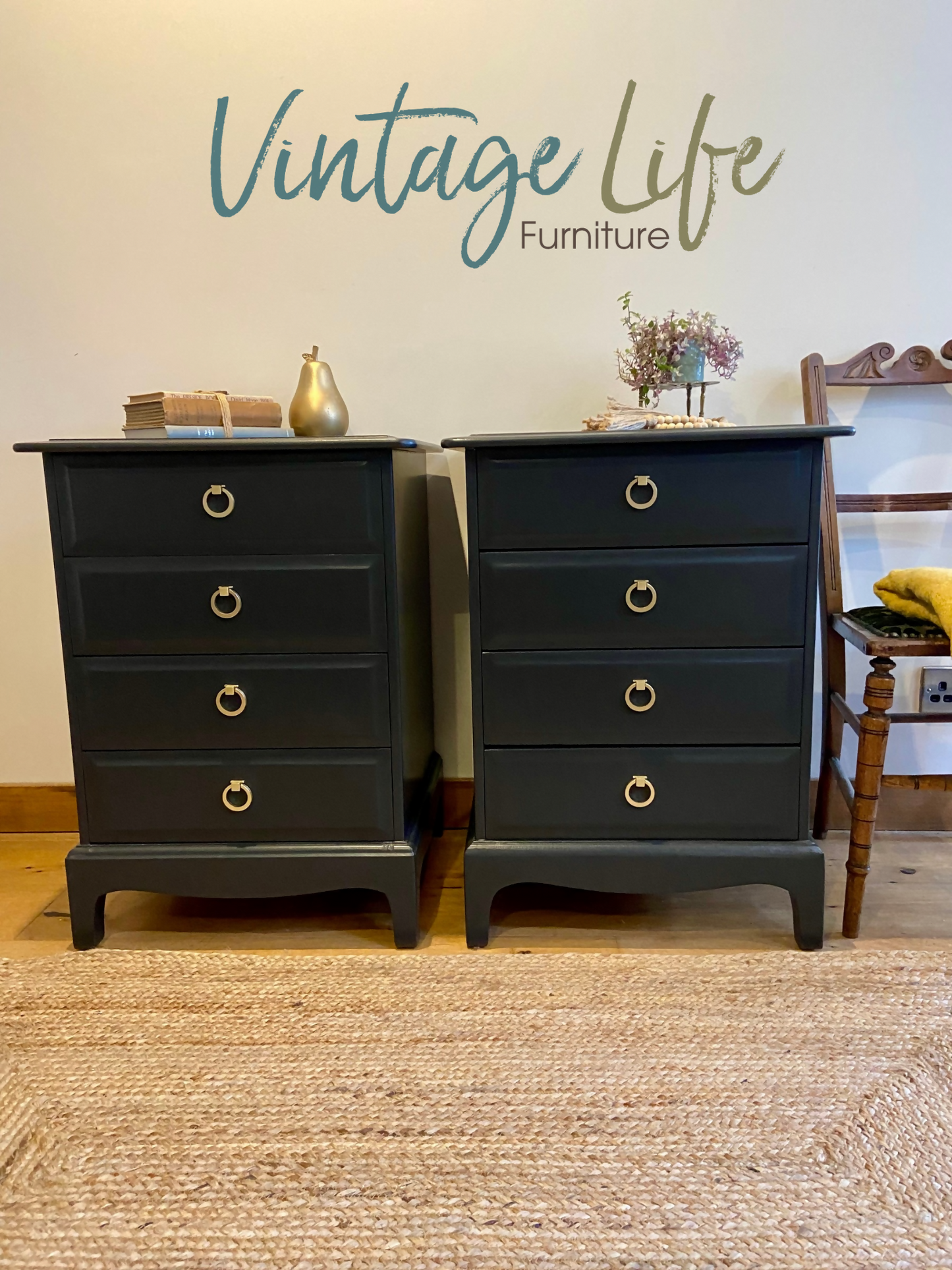 Stag four drawer black bedside cabinets, pair,