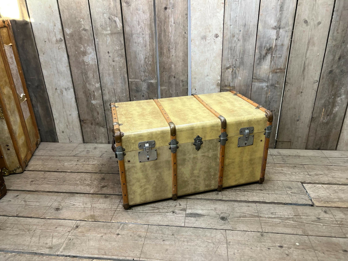 antique beige leather banded travel trunk with keys