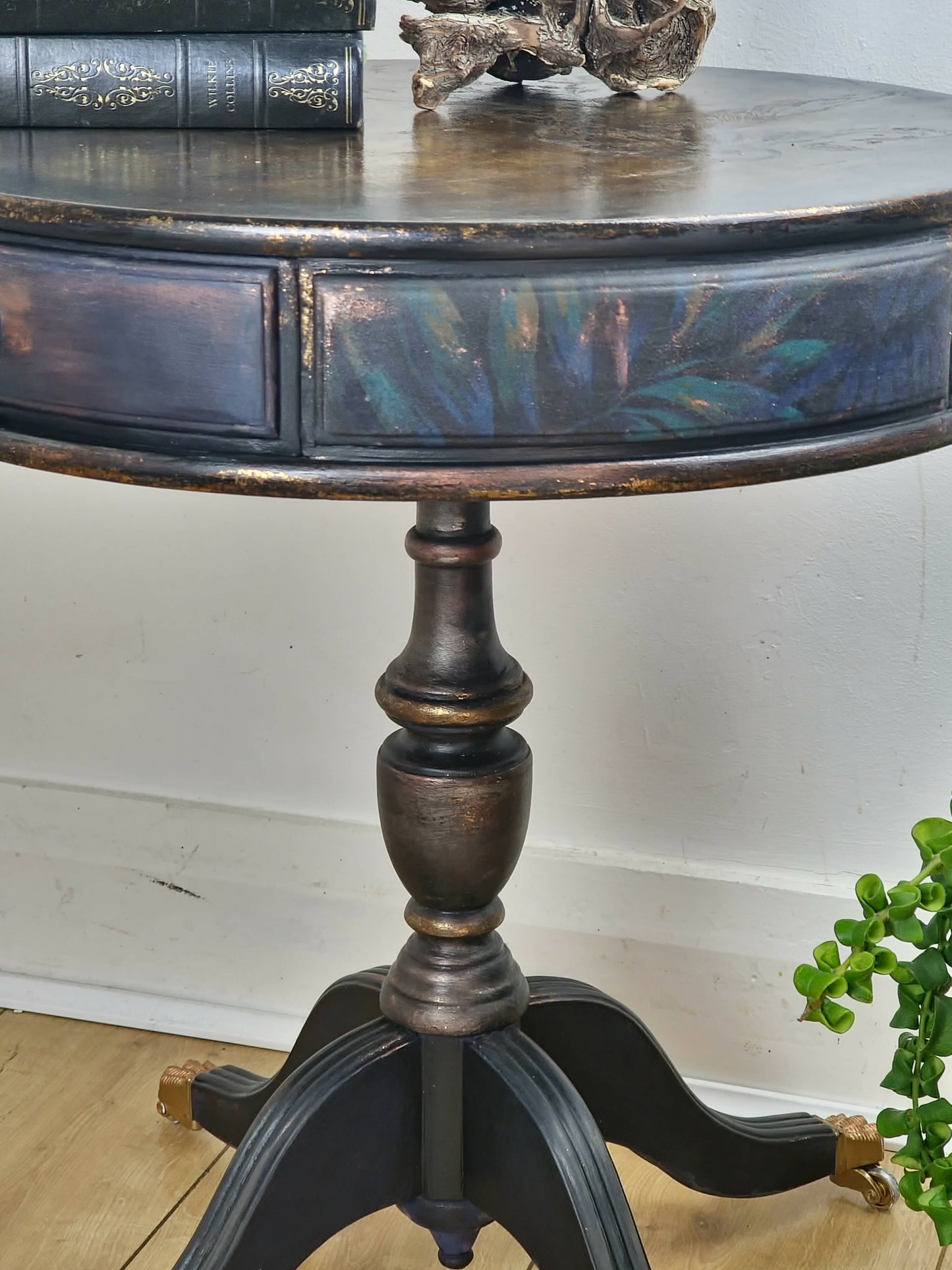 **Sold**Vintage Hand painted round side table, coffee table, Pedestal Drum Table, Round coffee table. Black table, Navy Gold Amber. Two drawers.