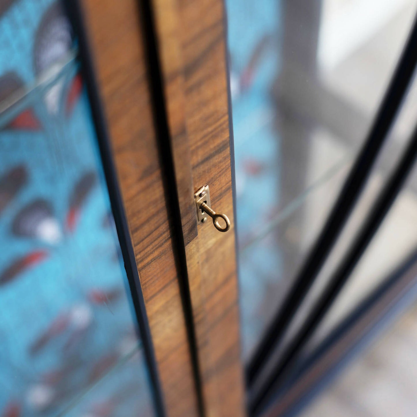 Blue Art Deco drinks cabinet, distinguished by its heart shape and decoupage featuring an African-inspired peacock feather fabric. Sold, commission available.