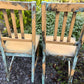Two pumpkin and copper dining chairs