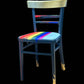 Hand painted school chair with vibrant rainbow stripe seat and gold leaf backrest. Abstract art design.