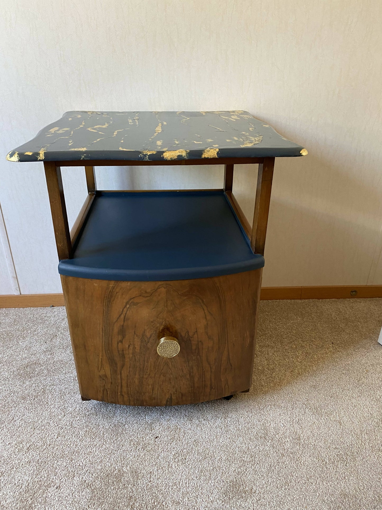 Vintage art deco cabinet with gold leaf