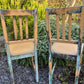 Two pumpkin and copper dining chairs