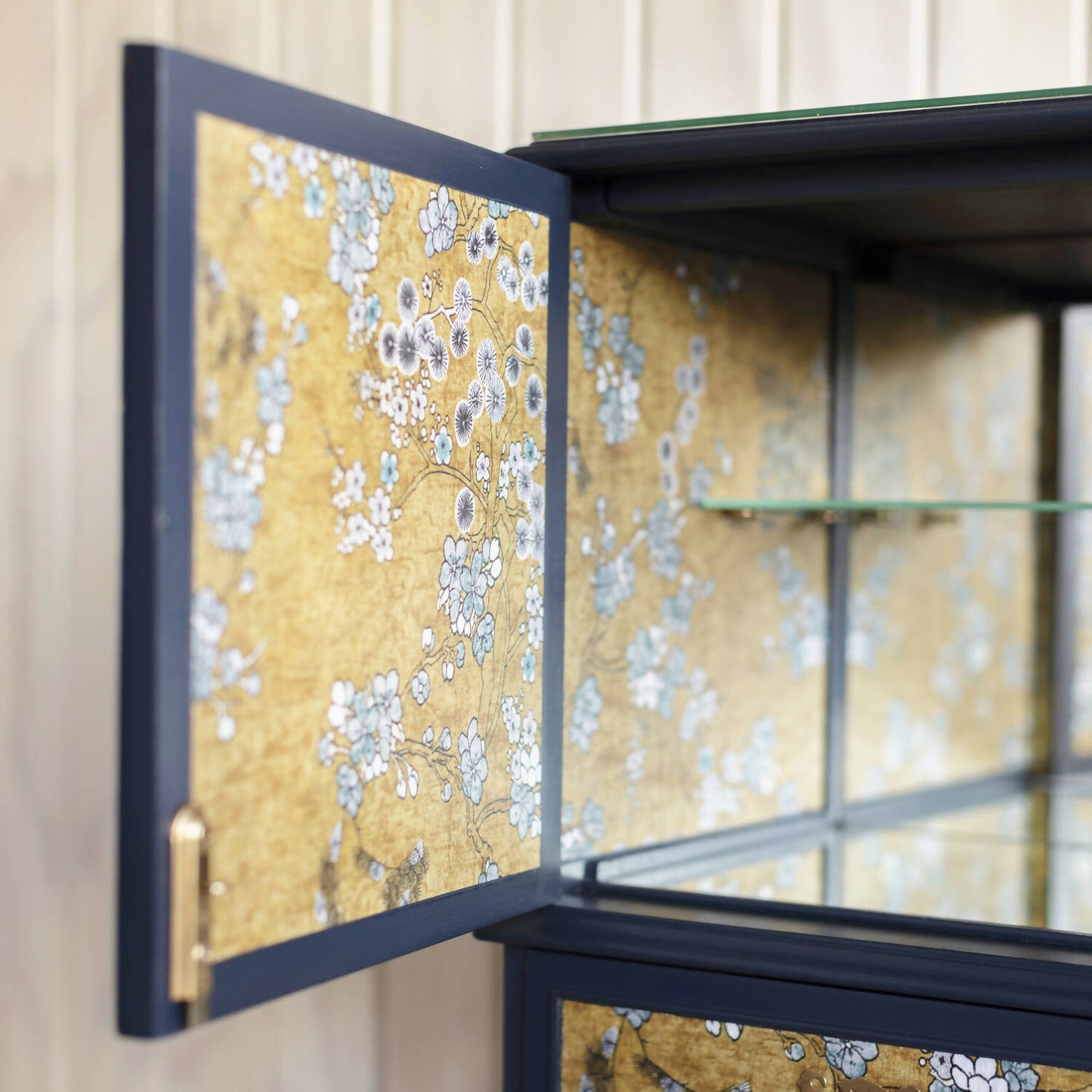 Exceptional vintage cocktail cabinet in midnight blue, boasting an oriental-inspired design.