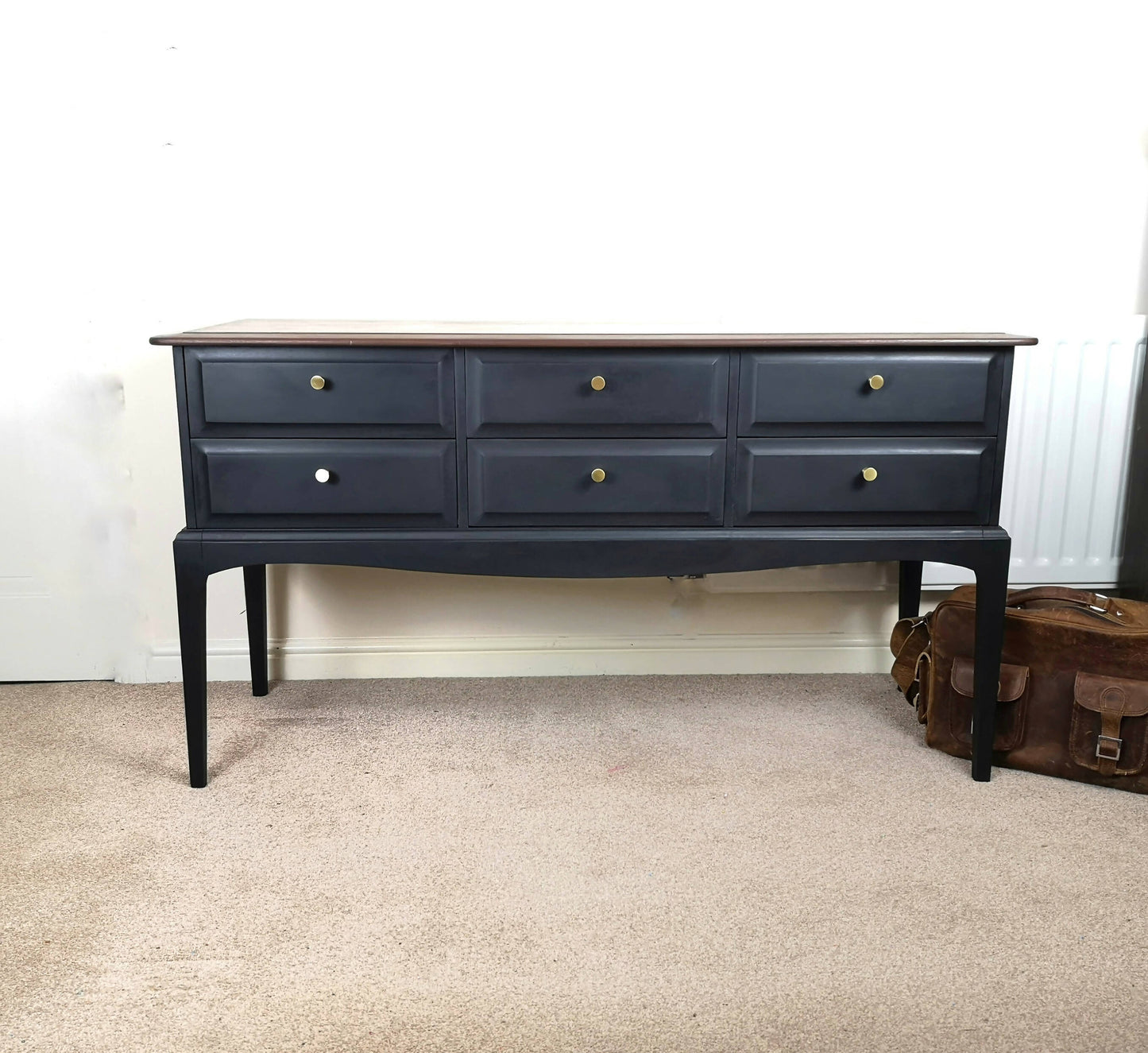 Stag Minstrel 6 drawer console table. Black with stripped & restored top with dark stain.