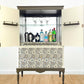 Drinks cabinet painted in olive green and cream