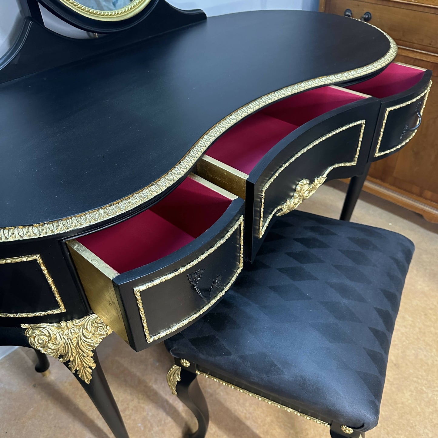 **This Item is Sold** Olympus dressing table and vintage stool. French Louis style in luxurious black with gold leaf and harlequin detail.